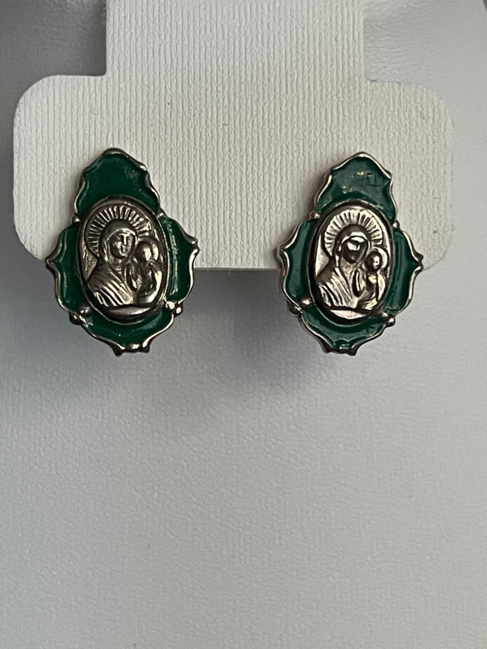 Sterling silver dangle earrings featuring image of the Virgin Mary and Child.